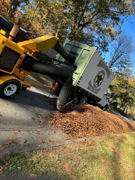 Big Star leaf vacuum truck collecting fall leaves in Greensboro, NC
